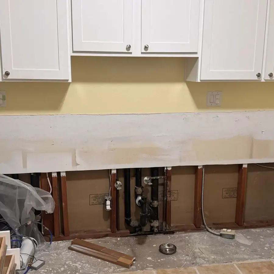 Kitchen cabinet base and drywall cut away after a sink and dishwasher leak in Pico Rivera, CA